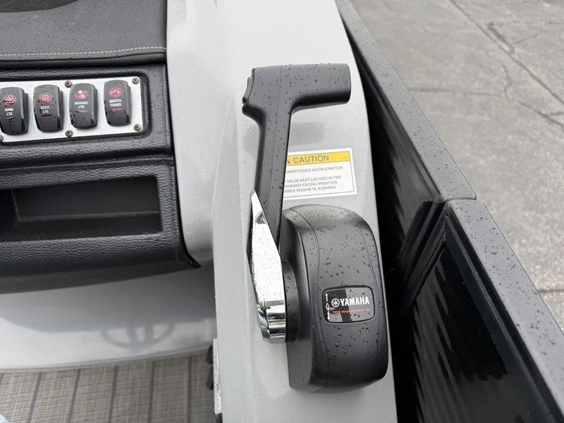 Slide: The Image of Control panel and throttle of 2021 Godfrey Monaco 235 SFL GTP boat, featuring Yamaha components. - 23