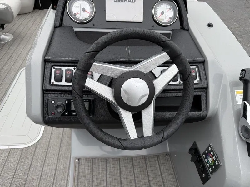 Slide: The Image of Steering console of 2021 Godfrey Monaco 235 SFL GTP boat with gauges and controls. - 26
