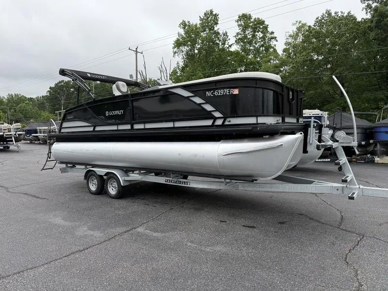Slide: The Image of 2021 Godfrey Monaco 235 SFL GTP pontoon boat on trailer, parked outdoors. - 4