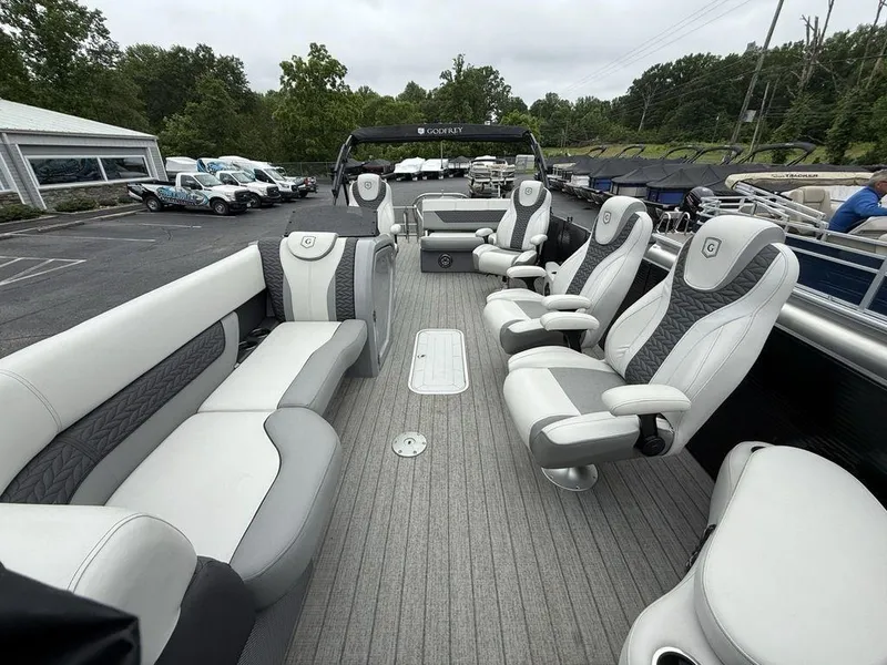 Slide: The Image of Luxurious 2021 Godfrey Monaco 235 SFL GTP pontoon boat with plush seating and modern design. - 9