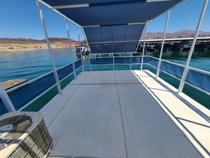 Slide: The Image of 1977 Stardust Cruisers houseboat bathroom with shower and blue gradient curtain. - 19