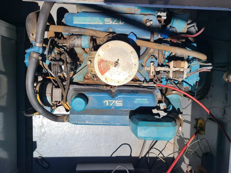 Slide: The Image of Engine compartment of a 1977 Stardust Cruisers houseboat with visible wiring and components. - 22