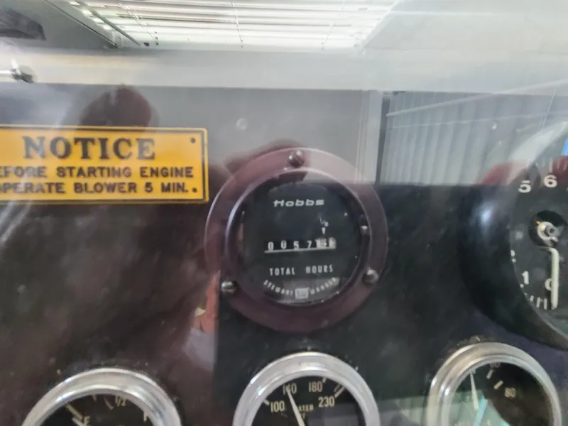 Slide: The Image of 1977 Stardust Cruisers houseboat kitchen with white cabinets, Galanz fridge, and modern appliances. - 9