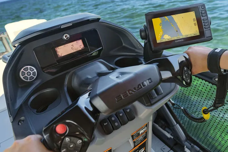 Slide: The Image of 2024 Sea-Doo Switch Cruise 18 dashboard with GPS navigation on a sunny day. - 5