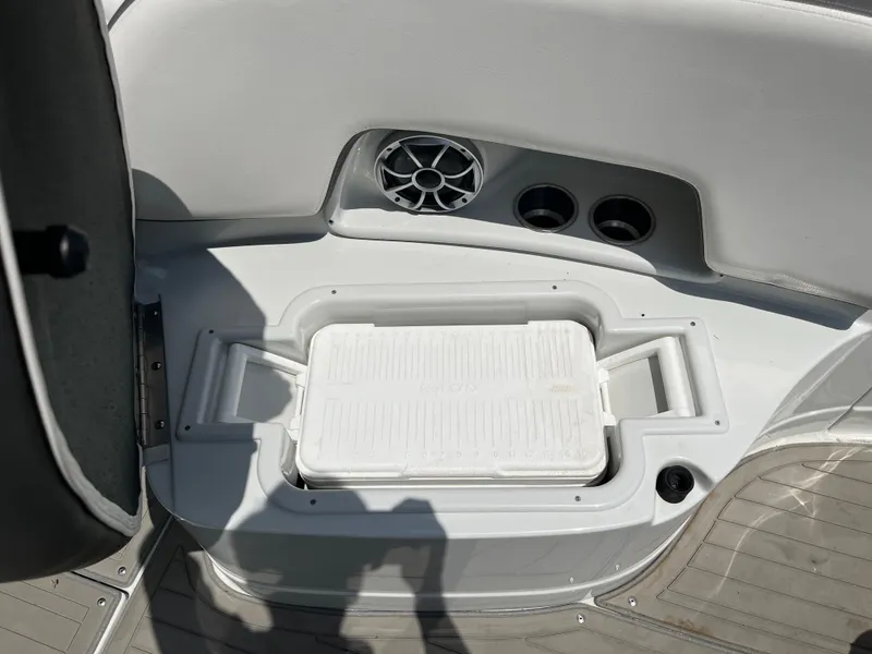 Slide: The Image of Interior of 2022 Crownline 280 SS boat with built-in cooler and speaker. - 15
