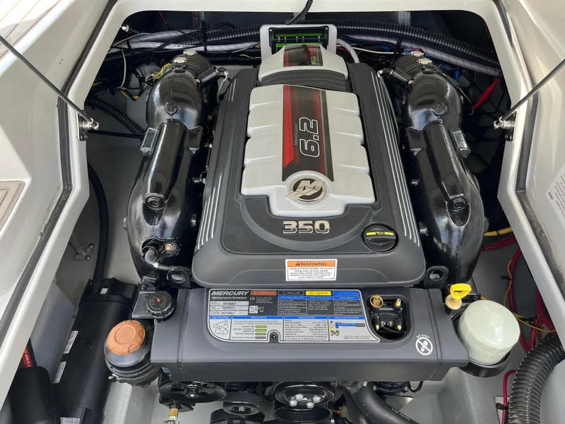Slide: The Image of Engine compartment of a 2022 Crownline 280 SS boat featuring a Mercury 6.2L 350 HP engine. - 17