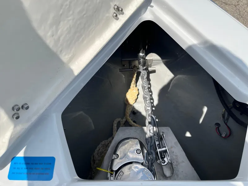 Slide: The Image of Anchor compartment of 2022 Crownline 280 SS boat with chain and rope. - 6