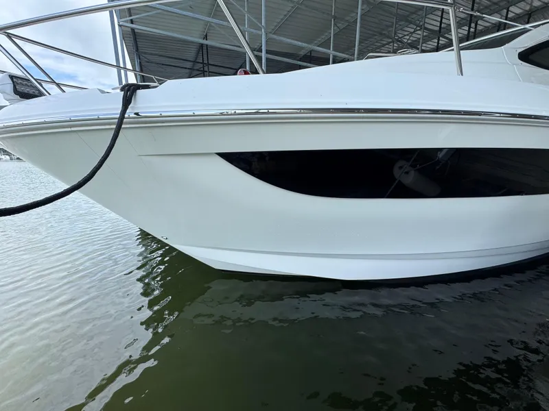 Slide: The Image of 2017 Sea Ray Sundancer 400 yacht docked in marina, side view. - 17