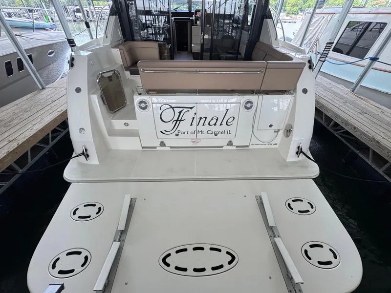 Slide: The Image of 2017 Sea Ray Sundancer 400 yacht docked, rear view with seating and "Finale" nameplate. - 25
