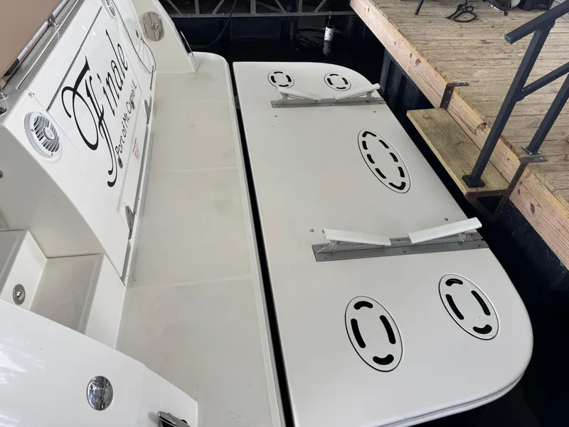 Slide: The Image of 2017 Sea Ray Sundancer 400 swim platform at dock, featuring sleek design and mooring cleats. - 26