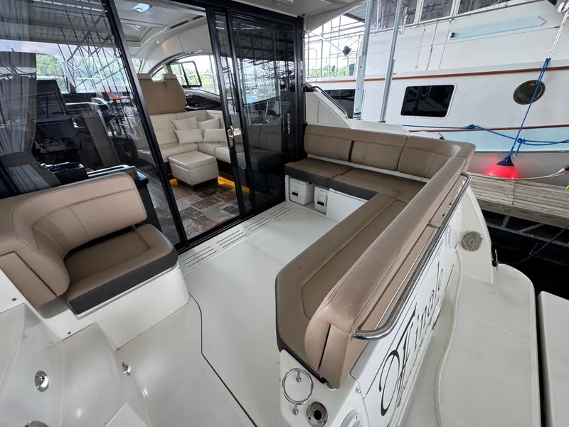 Slide: The Image of Luxurious 2017 Sea Ray Sundancer 400 yacht interior with plush seating and modern design. - 27