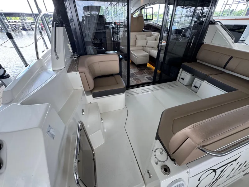 Slide: The Image of 2017 Sea Ray Sundancer 400 yacht interior with seating and glass doors. - 28