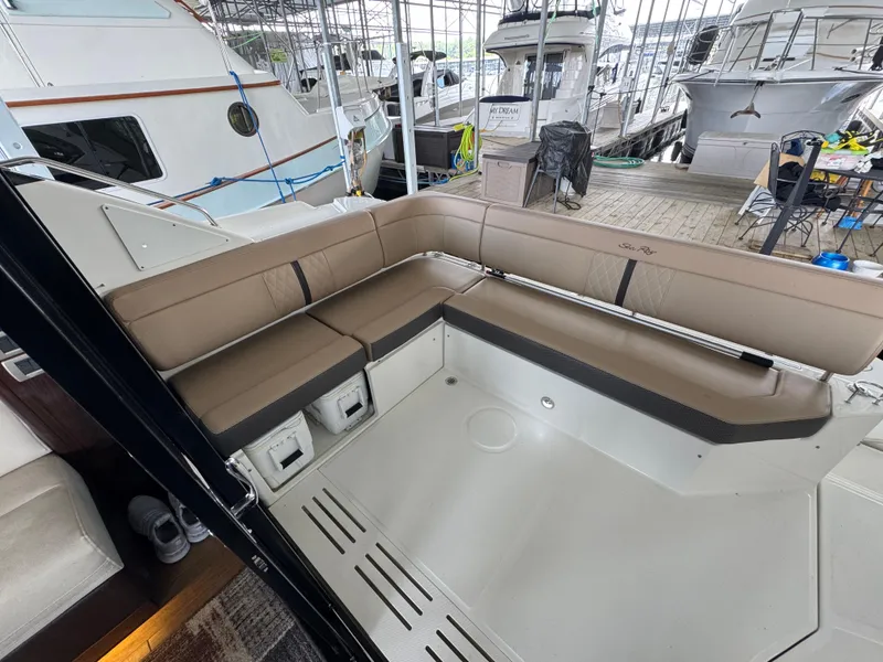 Slide: The Image of 2017 Sea Ray Sundancer 400 yacht with spacious outdoor seating area in marina. - 29