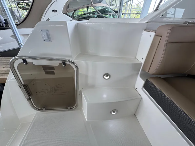 Slide: The Image of 2017 Sea Ray Sundancer 400 interior steps with seating and hatch door. - 31