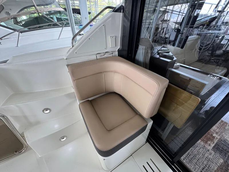 Slide: The Image of 2017 Sea Ray Sundancer 400 interior with beige seating and modern design. - 32