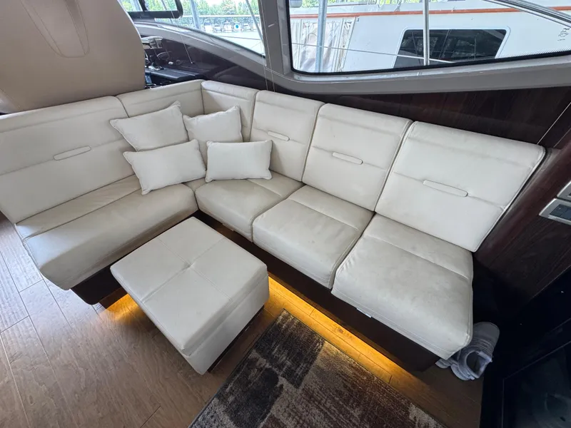 Slide: The Image of Luxurious interior of 2017 Sea Ray Sundancer 400 with cream leather seating and cushions. - 38