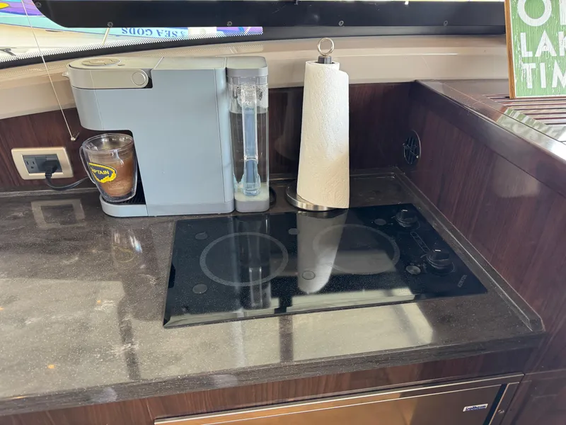Slide: The Image of Galley of 2017 Sea Ray Sundancer 400 with coffee maker and stovetop. - 40