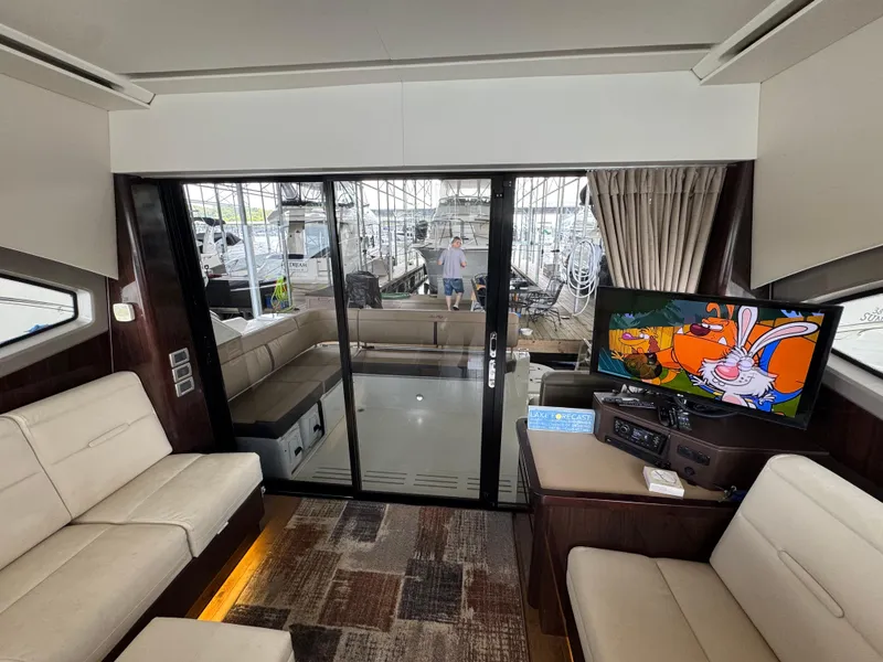 Slide: The Image of Luxurious interior of 2017 Sea Ray Sundancer 400 yacht with TV and seating area. - 45