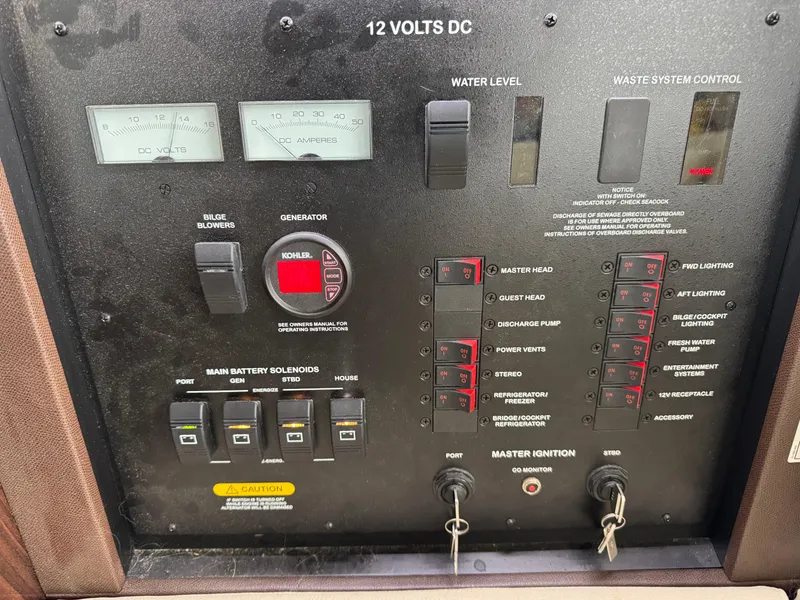 Slide: The Image of Control panel of a 2017 Sea Ray Sundancer 400 yacht, featuring various switches and gauges. - 49