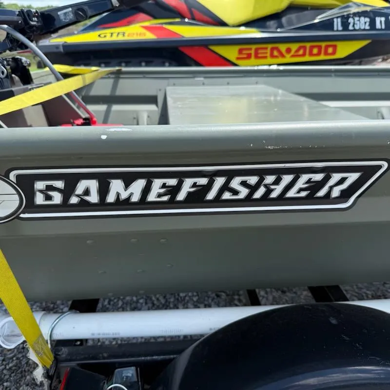 Slide: The Image of 2022 Gamefisherman J 1436 boat with visible logo and nearby Sea-Doo watercraft. - 4