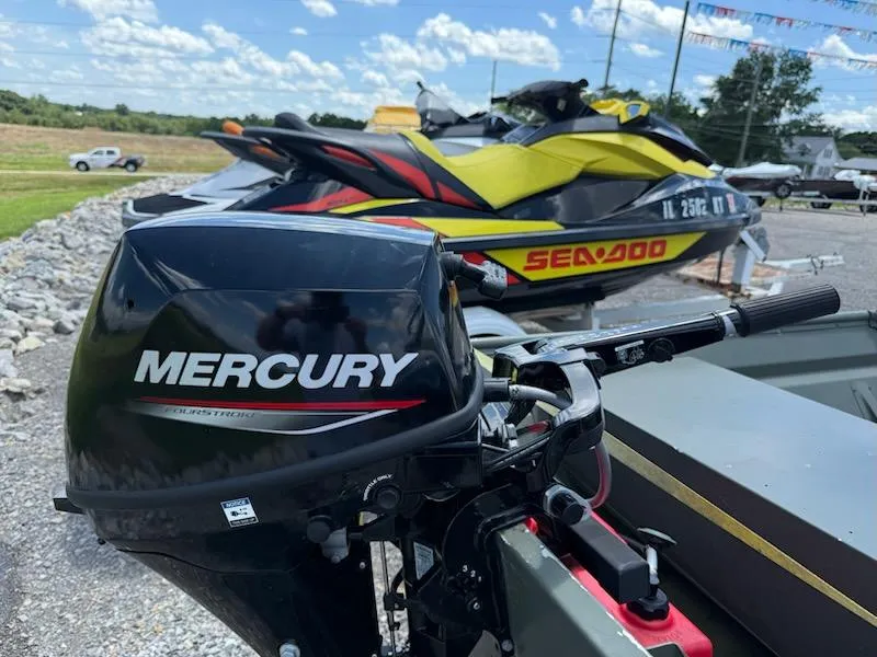 Slide: The Image of Mercury outboard motor on Gamefisherman J 1436, 2022 model, with Sea-Doo in background. - 5