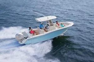 Slide: The Image of 2026 Grady-White Fisherman 236 boat with Yamaha engine displayed at a boat show. - 2