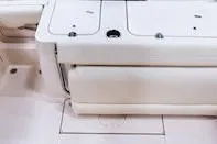 Slide: The Image of Interior view of 2026 Grady-White Fisherman 236 boat cabin with toilet and mirror. - 6