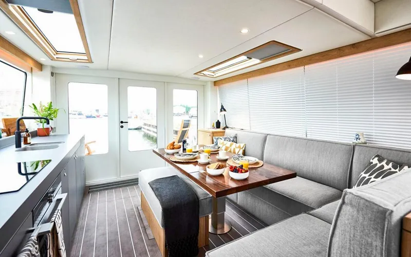 Slide: The Image of Luxurious interior of 2026 Bestevaer 53 M/Y yacht with modern kitchen and dining area. - 14