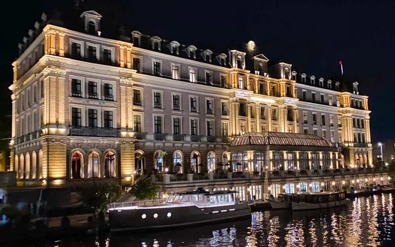 Slide: The Image of Luxurious Bestevaer 53 M/Y yacht docked by an illuminated historic building at night, 2026 model. - 34