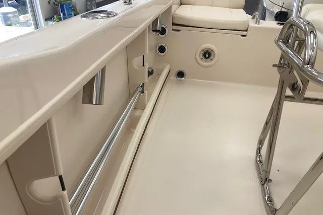 Slide: The Image of 2026 Grady-White Fisherman 180 boat interior, featuring seating and stainless steel fixtures. - 10