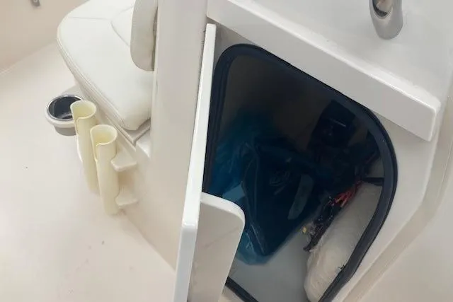 Slide: The Image of 2026 Grady-White Fisherman 180 boat interior with storage compartment and seating. - 14