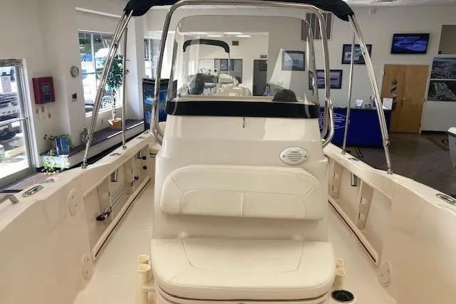 Slide: The Image of 2026 Grady-White Fisherman 180 boat interior, showroom display with seating and console. - 5