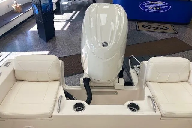 Slide: The Image of 2026 Grady-White Fisherman 180 boat interior with engine and seating area. - 9