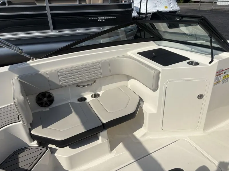 Slide: The Image of 2021 Sea Ray SPX 190 boat interior with seating and storage compartments. - 10