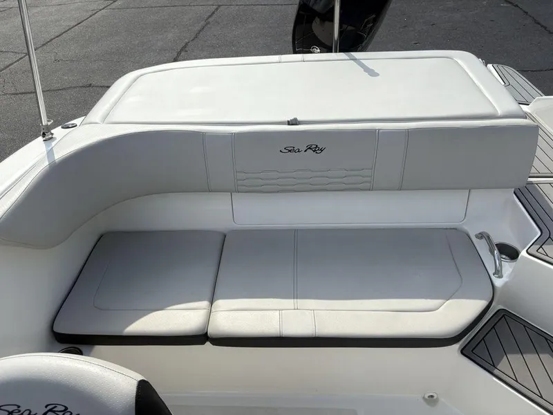 Slide: The Image of 2021 Sea Ray SPX 190 boat interior with cushioned seating and sleek design. - 14