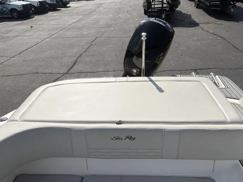 Slide: The Image of 2021 Sea Ray SPX 190 boat with outboard motor, parked on asphalt. - 18