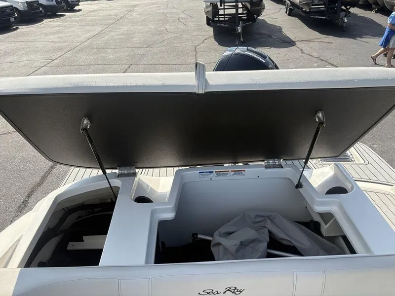 Slide: The Image of Open storage compartment on a 2021 Sea Ray SPX 190 boat, showing interior space. - 20