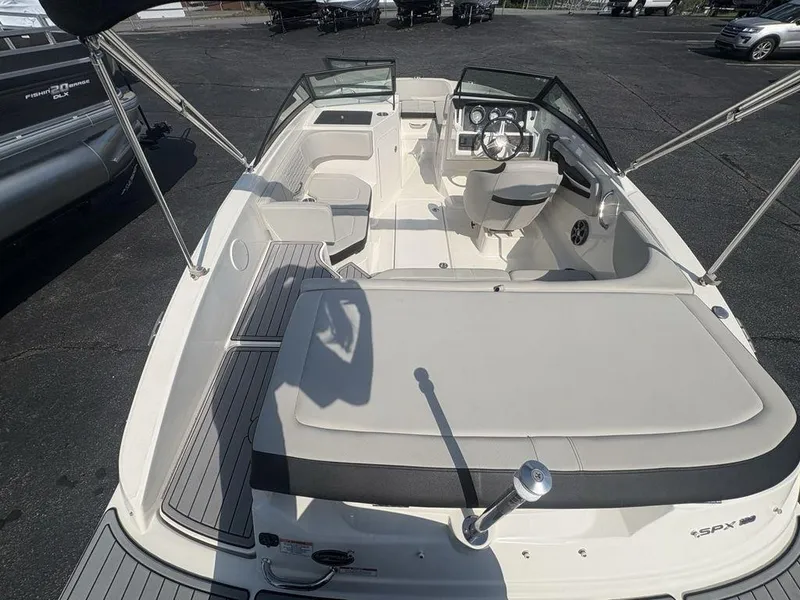 Slide: The Image of 2021 Sea Ray SPX 190 boat interior with seating and steering console. - 24