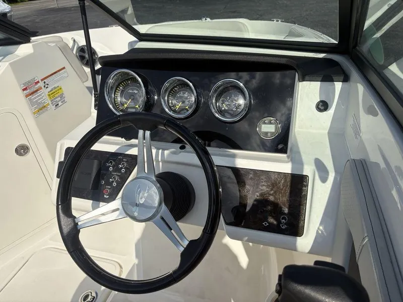 Slide: The Image of 2021 Sea Ray SPX 190 dashboard with steering wheel and instrument panel. - 26