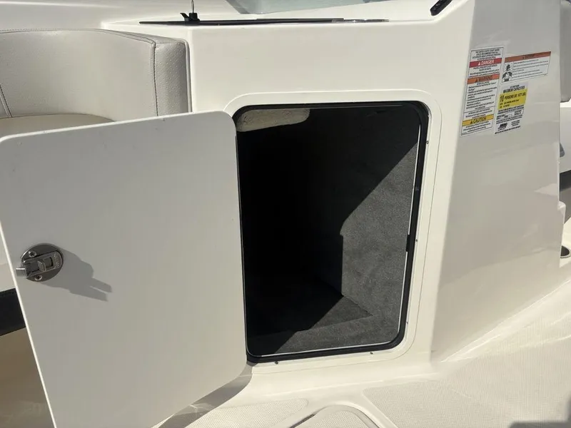 Slide: The Image of Open storage compartment on a 2021 Sea Ray SPX 190 boat. - 4