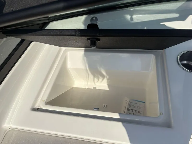 Slide: The Image of Open storage compartment on a 2021 Sea Ray SPX 190 boat. - 7