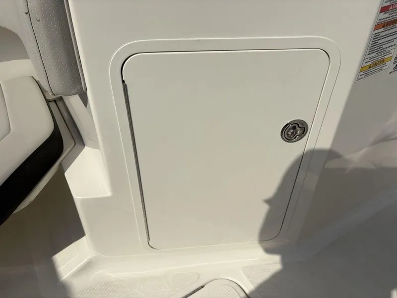 Slide: The Image of Storage compartment on a 2021 Sea Ray SPX 190 boat interior. - 8