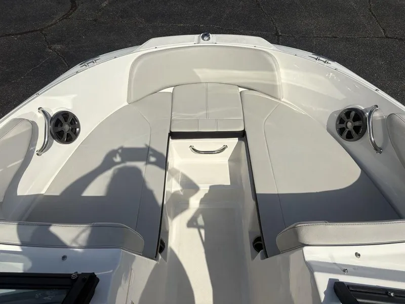 Slide: The Image of 2021 Sea Ray SPX 190 boat interior with gray seating and built-in speakers. - 9