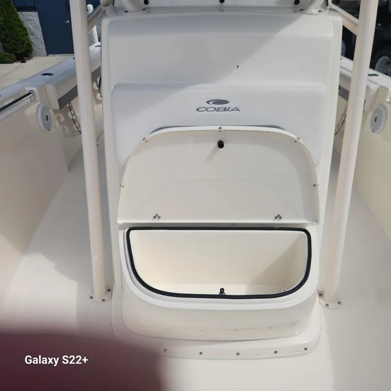 Slide: The Image of 2018 Cobia 261 Center Console boat storage compartment, open and ready for use. - 20