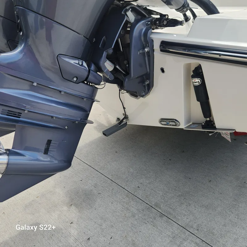 Slide: The Image of 2018 Cobia 261 Center Console boat engine and transom detail. - 31