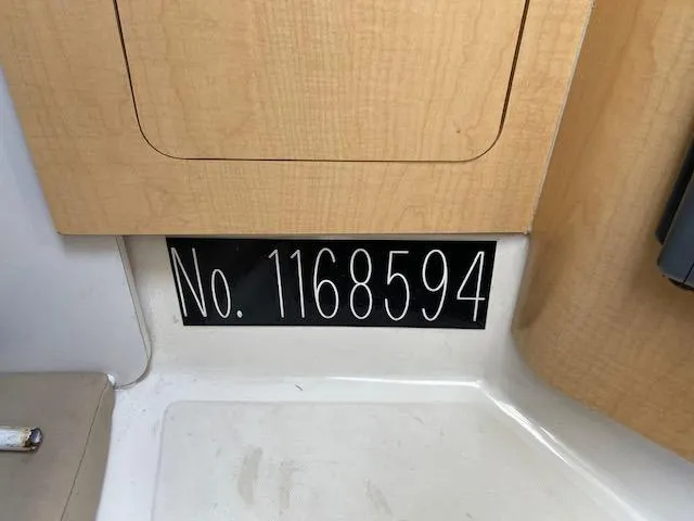 Slide: The Image of 2005 Boston Whaler 275 Conquest interior with registration number 1168594 displayed. - 18