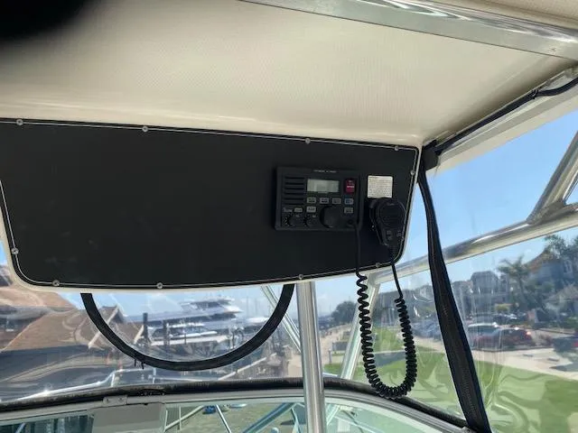 Slide: The Image of 2005 Boston Whaler 275 Conquest boat interior with mounted radio system. - 20