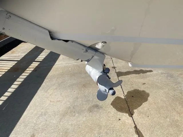 Slide: The Image of Propeller of 2005 Boston Whaler 275 Conquest boat on concrete surface. - 3