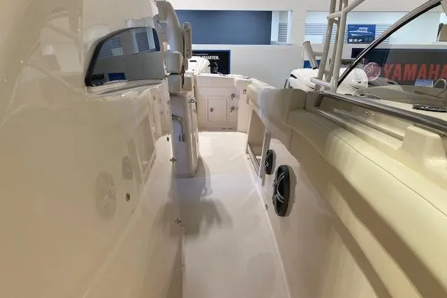 Slide: The Image of 2026 Grady-White Canyon 336 boat interior showcasing spacious deck and seating area. - 12