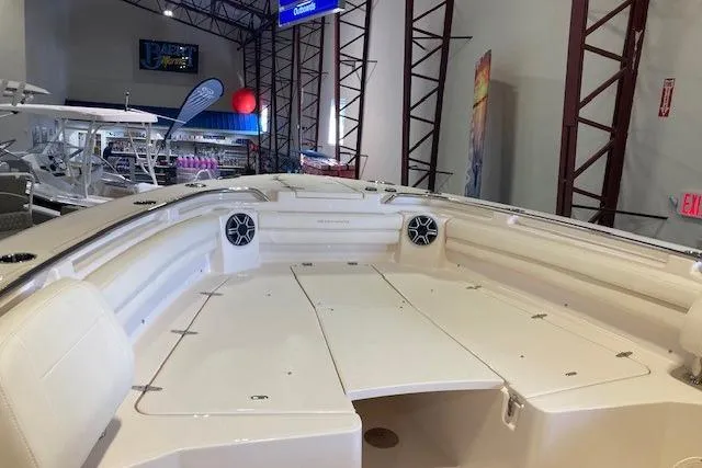Slide: The Image of 2026 Grady-White Canyon 336 boat interior, showcasing spacious deck and seating area. - 13